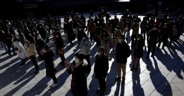 People wearing protective masks amid the coronavirus outbreak pray on the first day of the new year at the Meiji Shrine in Tokyo, Japan, Jan. 1, 2021. (Reuters Photo)