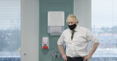 Britain's Prime Minister Boris Johnson during a visit to view the vaccination program at the Chase Farm Hospital, part of the Royal Free London NHS Foundation Trust, in north London, Jan. 4, 2021. (AP Photo)