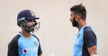 India’s Cheteshwar Pujara (R) talks to the team's captain Ajinkya Rahane during a training session, in Sydney, Australia, Jan. 5, 2021. (AFP Photo)