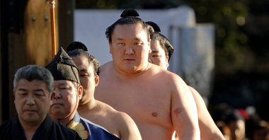 Hakuho, second from right, arrives to perform his ring entry, in Tokyo, Japan, Jan. 9, 2018. (AP Photo)
