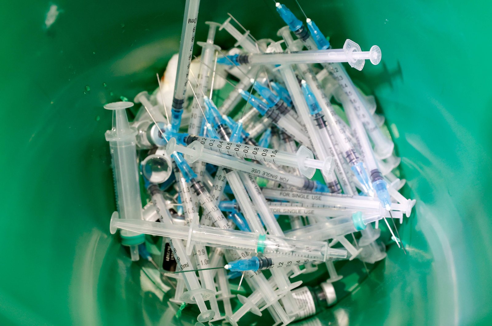 Discarded syringes, used to administer the COVID-19 vaccine, are pictured inside a waste container at a health center, Umm al-Fahm, Israel, Jan. 4, 2021. (AFP Photo)