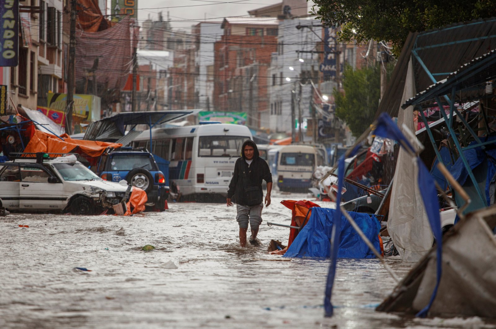 Cars and market stalls washed away after flash flood in ...