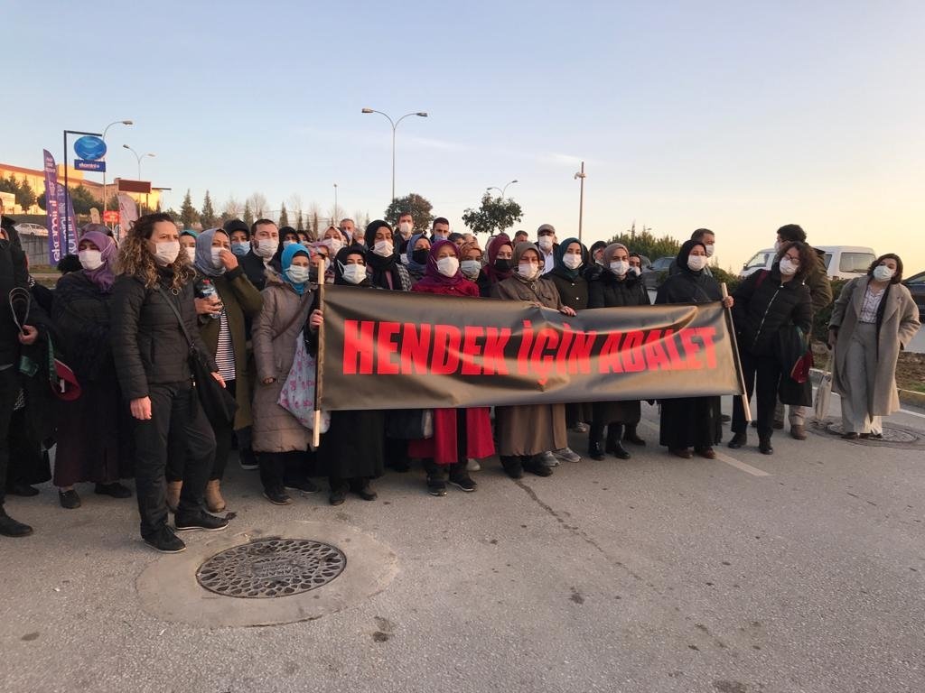 People gather outside the courthouse carry a banner reading "Justice For Hendek" in Turkish, in Sakarya, northwestern Turkey, Jan. 6, 2021. (AA Photo)