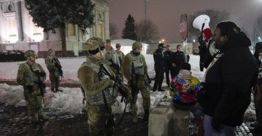 A group of protesters confronts National Guard members outside a museum, in Kenosha, Wisconsin, U.S., Jan. 5, 2021. (AP Photo)
