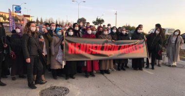 People gather outside the courthouse carry a banner reading "Justice For Hendek" in Turkish, in Sakarya, northwestern Turkey, Jan. 6, 2021. (AA Photo)