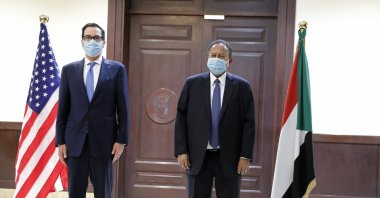 Sudanese Prime Minister Abdullah Hamdok (R) welcomes U.S. Treasury Secretary Steven Mnuchin to the Cabinet Building, in Khartoum, Sudan, Jan. 6, 2021. (AP Photo)