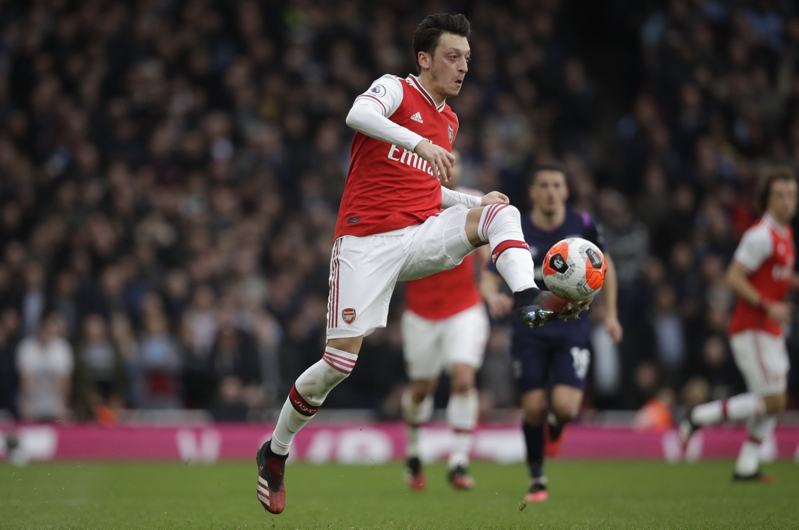 Arsenal's Mesut Özil controls the ball during a Premier League against West Ham at the Emirates Stadium, in London, Britain, March 7, 2020. (AP Photo)