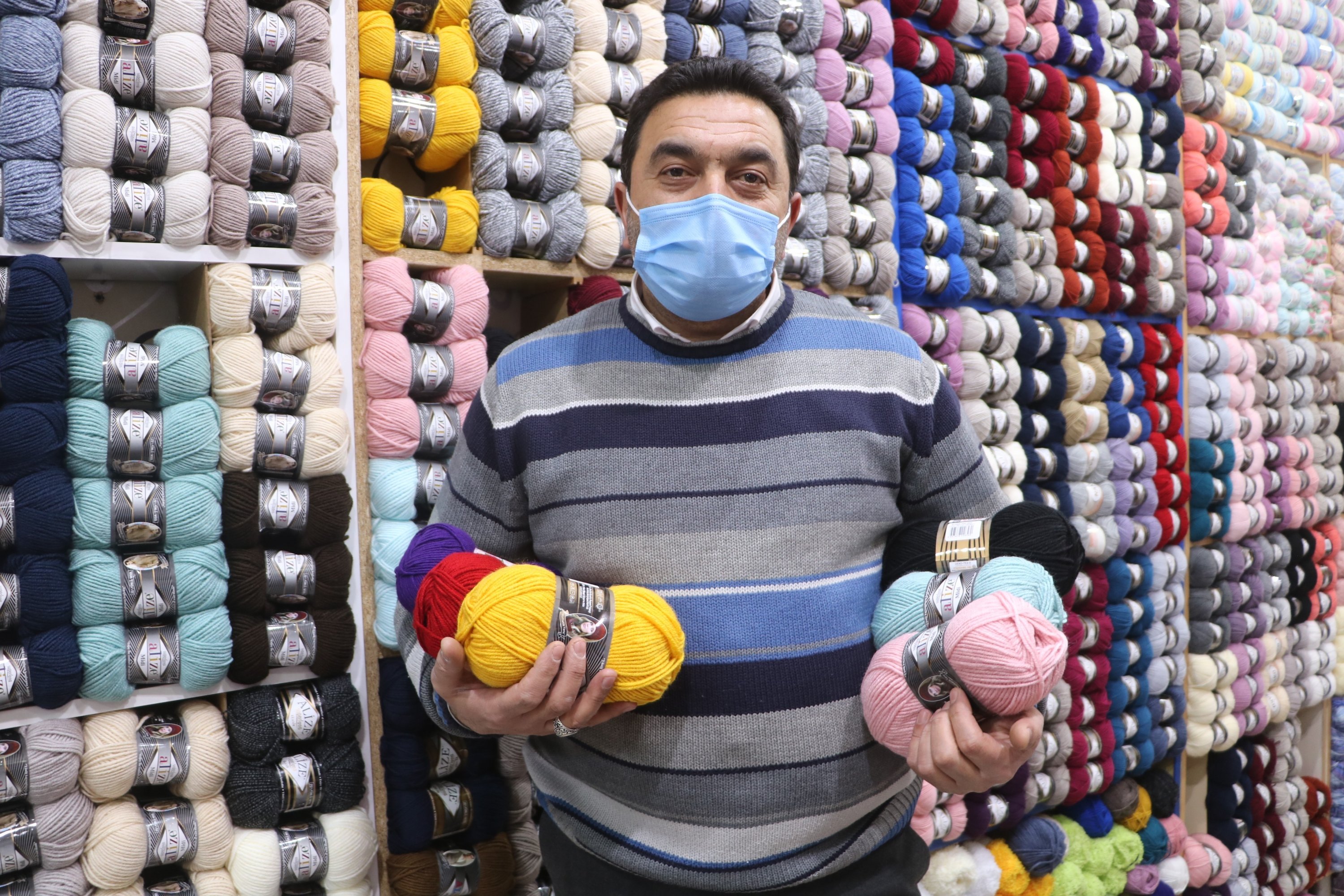 Yıldırım Yalçıner, a local shopkeeper selling knitting supplies, has seen a significant rise in sales in Sivas, central Turkey, Jan. 7, 2021. (IHA Photo)