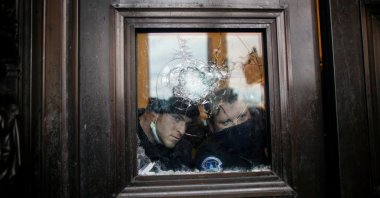 Members of the Capitol police look through a smashed window as pro-Trump protesters rally to contest the certification of the 2020 U.S. presidential election results by the U.S. Congress, at the U.S. Capitol Building in Washington, D.C., U.S. Jan. 6, 2021. (Reuters Photo)