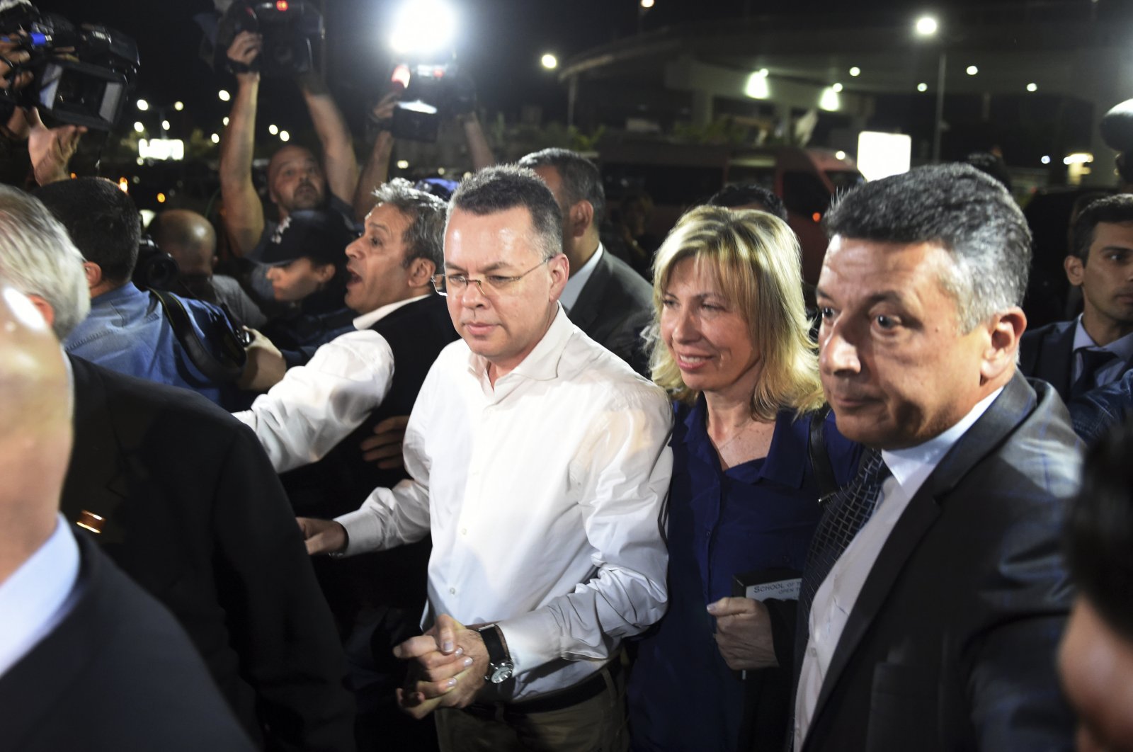 Andrew Brunson (C) arrives at the airport after his release, in Izmir, western Turkey, Oct. 12, 2018. (AP Photo)