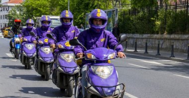 Getir moto-couriers line up in a street in Turkey, Jan. 17, 2020. (IHA Photo)