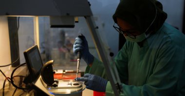 An analyst of the Global Halal Centre works at a laboratory where Sinovac's vaccine for the coronavirus was analyzed for halal certification, in Bogor, Indonesia, Jan. 6, 2021. (Reuters Photo)