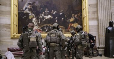 After violent protesters loyal to President Donald Trump stormed the U.S. Capitol, an ATF tactical team gathers in the Rotunda to provide security for the continuation of the joint session of the House and Senate to count the Electoral College votes cast in November's election, at the Capitol in Washington, D.C., U.S., Jan. 6, 2021. (AP Photo)