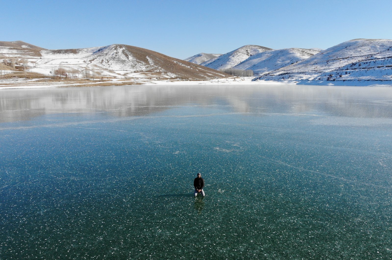 Gökçedere Dam Lake, frozen during the winter, offers a fascinating, picturesque landscape, Bayburt, northeastern Turkey, Jan. 6, 2021. (AA Photo)