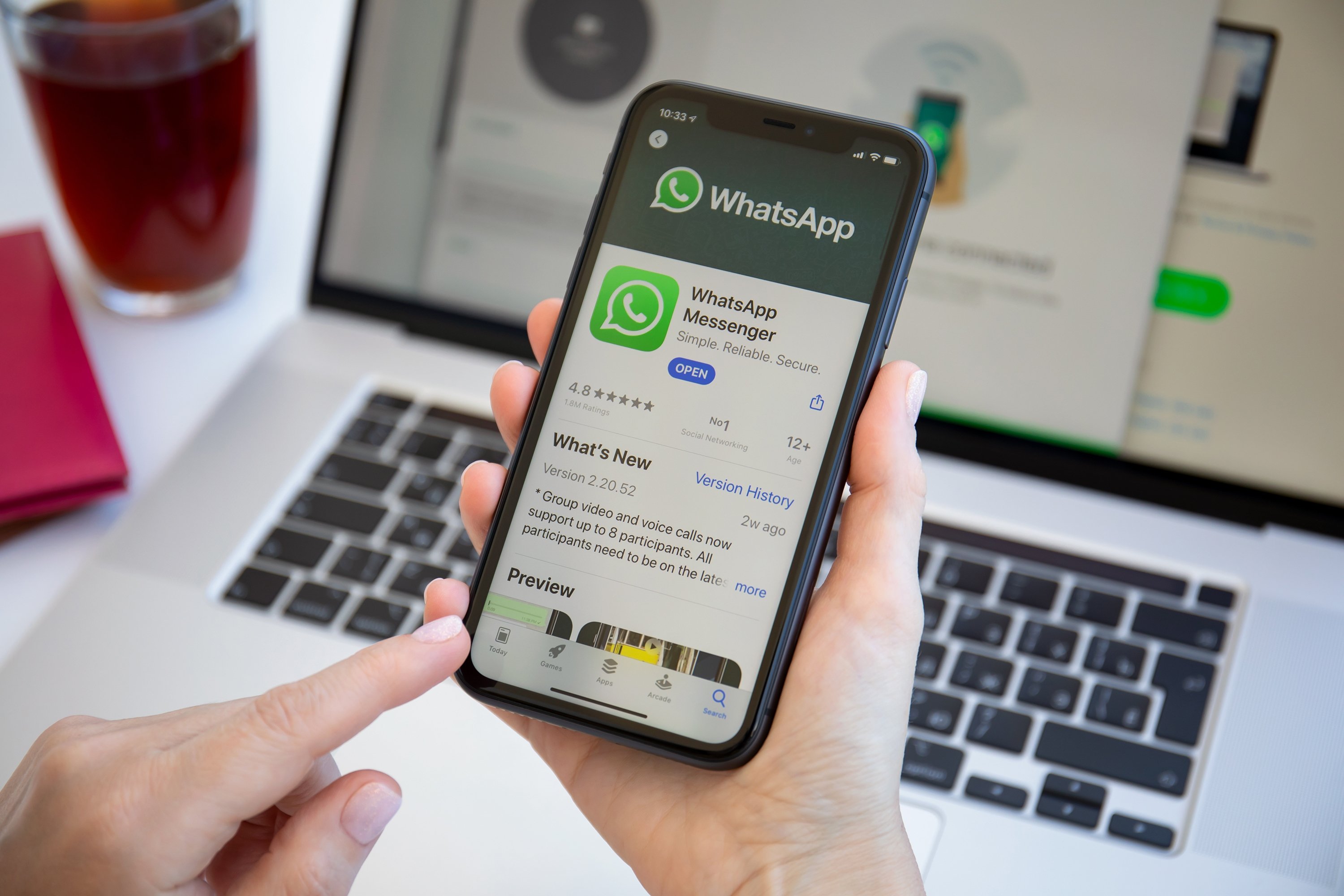 A user holds a phone with messaging app WhatsApp on the screen in the southern resort town of Alanya, in Antalya province, Turkey, June 6, 2020. (Shutterstock Photo)