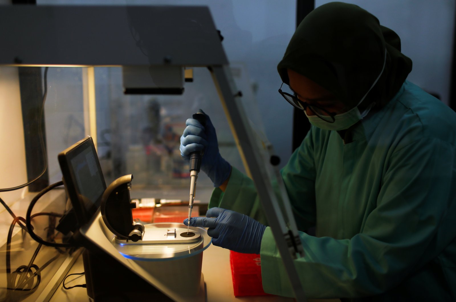 An analyst of the Global Halal Centre works at a laboratory where Sinovac's vaccine for the coronavirus was analyzed for halal certification, in Bogor, Indonesia, Jan. 6, 2021. (Reuters Photo)
