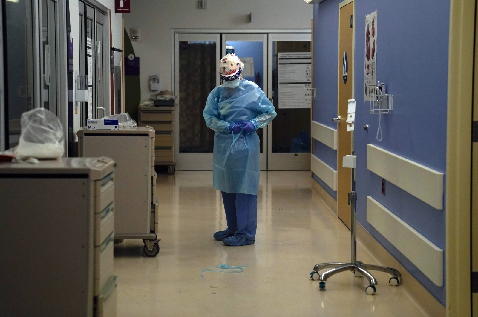 A nurse puts on protective gear in a COVID-19 unit in California, Jan. 7, 2021. (AP Photo)