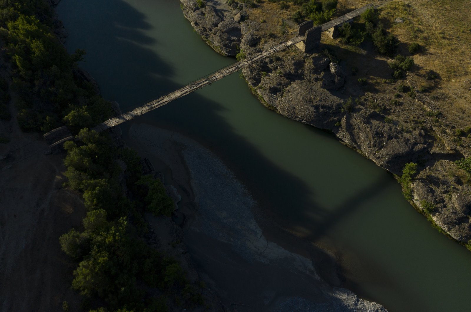 An old bridge spans the Vjosa River near the border with Greece, in Albania, June 30, 2019. (AP Photo)