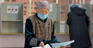 People cast their vote during Kyrgyzstan's presidential election and a referendum on the government system in the village of Koy-Tash outside Bishkek on Jan. 10, 2021. (AFP Photo)