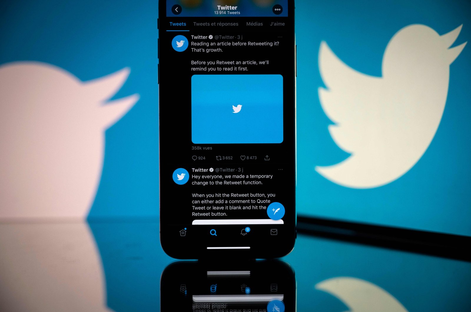 The logo of U.S. social network Twitter is displayed on the screen of a smartphone and a tablet in Toulouse, southern France, Oct. 26, 2020. (AFP Photo)