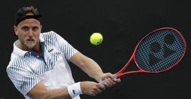 Denis Kudla plays a shot to Diego Schwartzman during an Australian Open tennis match, in Melbourne, Australia, Jan. 16, 2019. (AP Photo)
