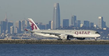 A Qatar Airways plane prepares to take off at San Francisco International Airport during the coronavirus pandemic in San Francisco, California, U.S., Dec. 22, 2020. (AP Photo)