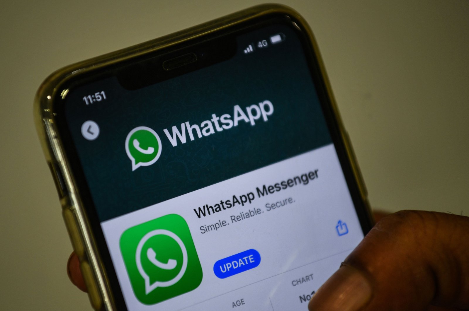 A user updates the WhatsApp application on his mobile phone in Mumbai, India, Nov. 6, 2020. (AFP Photo)