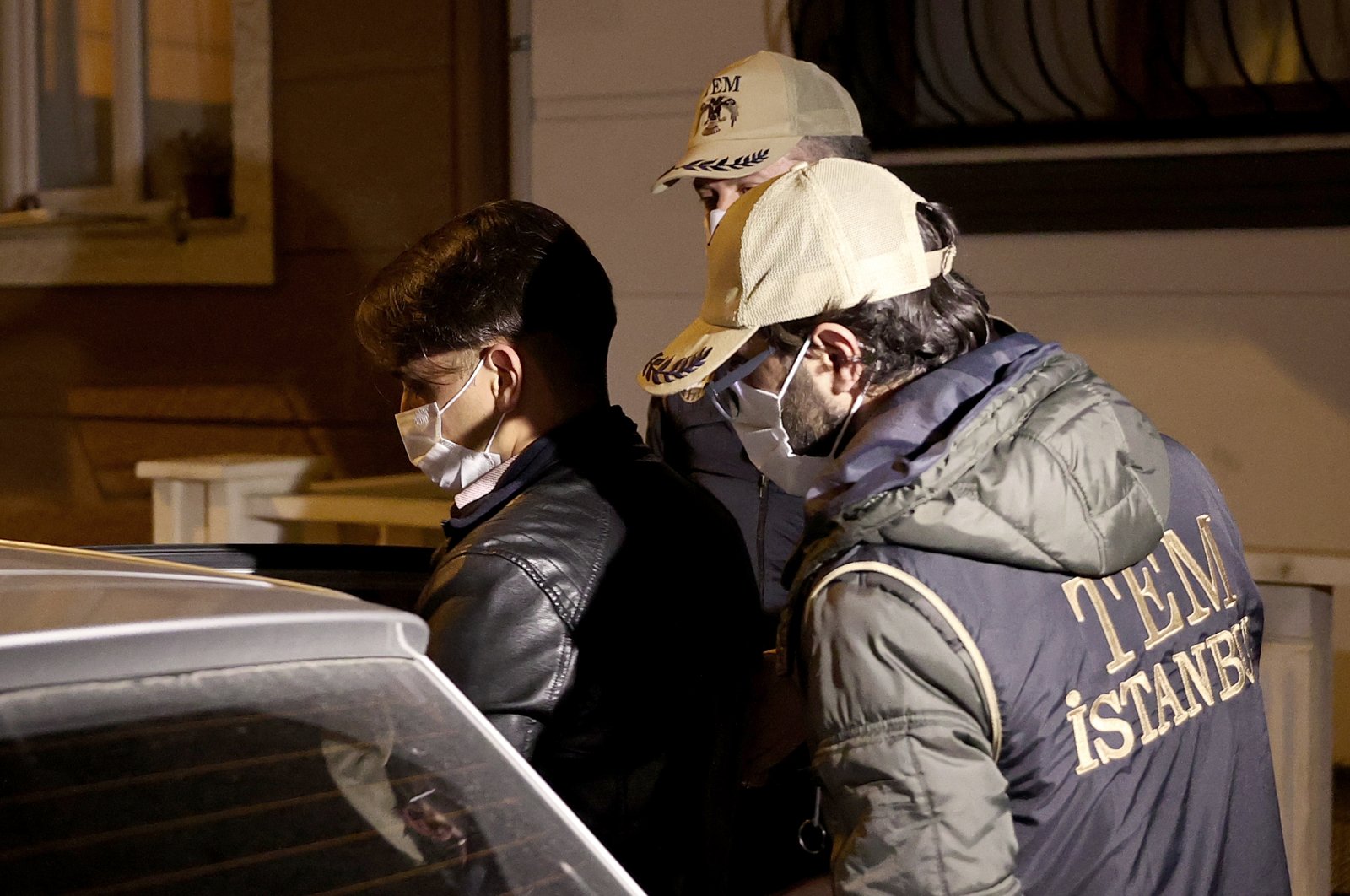 Police escort a FETÖ suspect captured in Istanbul, Turkey, Jan. 12, 2021. (AA PHOTO) 