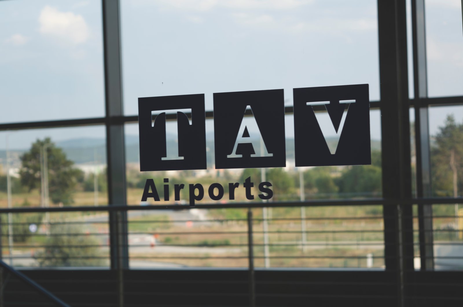 TAV Airports logo on an airport window in Skopje, Macedonia, Aug. 10, 2019. (Shutterstock Photo)