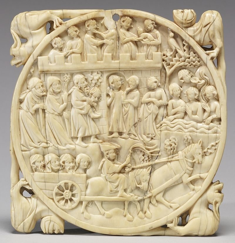 A 14th-century French ivory mirror case carved with a scene of the fountain of youth.