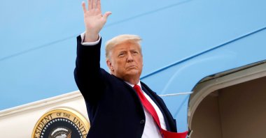 U.S. President Donald Trump salutes as he boards Air Force One at Valley International Airport after visiting the U.S.-Mexico border wall, in Harlingen, Texas, U.S., Jan. 12, 2021. (Reuters Photo)