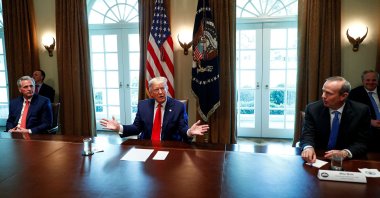 U.S. President Donald Trump speaks during a roundtable with energy sector CEOs as House Minority Leader Kevin McCarthy (R-CA) and Chevron CEO Mike Wirth listen in the Cabinet Room of the White House in Washington, U.S., April 3, 2020. (Reuters File Photo)