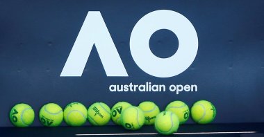 Tennis balls are pictured in front of the Australian Open logo before the tennis tournament, in Melbourne, Australia, Jan. 14, 2018. (Reuters Photo)