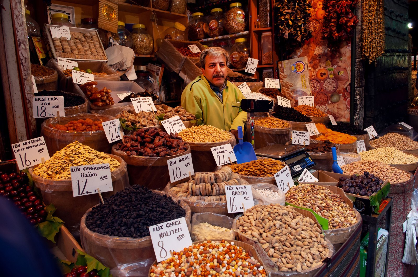 A Turkish stallholder selling dried fruits and nuts at the Spice Bazaar in Istanbul, May 20, 2010. (Getty Images Photo)