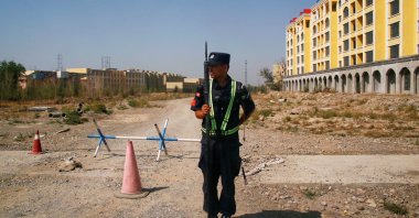 A Chinese police officer takes his position near what is officially known as a vocational education center in Yining, Xinjiang Uighur Autonomous Region, China, Sept. 4, 2018. (Reuters Photo)