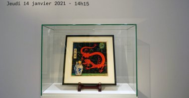 Painting for the original cover of "The Blue Lotus" Tintin comic book (1936) is displayed before being auctioned by Artcurial in Paris, France on Jan. 13, 2021. (Reuters Photo)