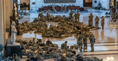 Hundreds of National Guard troops rest inside the U.S. Capitol in Washington, D.C, U.S., Jan. 13, 2021. (AP Photo)