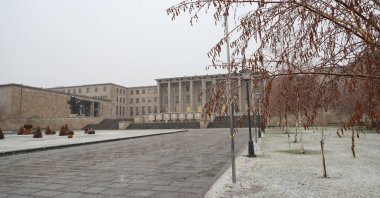 The Turkish Grand National Assembly (TBMM) is seen as snow falls in the capital Ankara, Turkey, Jan. 13, 2021. (AA Photo)