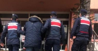 Gendarme officers escort a FETÖ suspect detained in Karabük, northern Turkey, Jan. 15, 2021. (AA Photo)