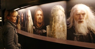 A woman looks at the different characters from "The Lord of the Rings" films, at an exhibition in Potsdam, eastern Germany, Jan. 30, 2007 . (MICHAEL URBAN/DDP/AFP via Getty Images)