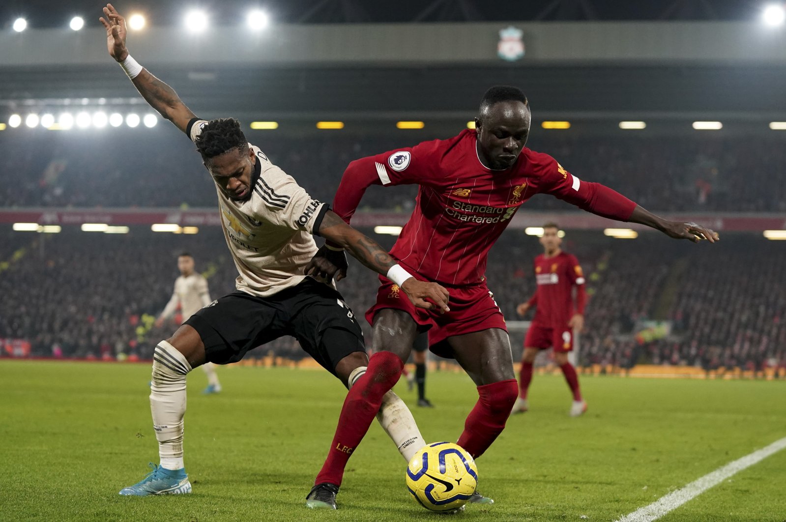 Liverpool's Sadio Mane (R) and Manchester United's Fred vie for the ball during a Premier League match at the Anfield stadium in Liverpool, Britain, Jan. 19, 2020. (AP Photo)
