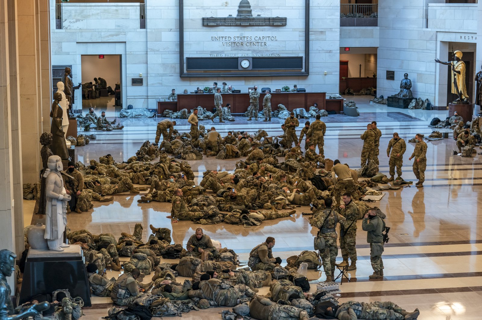 Hundreds of National Guard troops rest inside the U.S. Capitol in Washington, D.C, U.S., Jan. 13, 2021. (AP Photo)