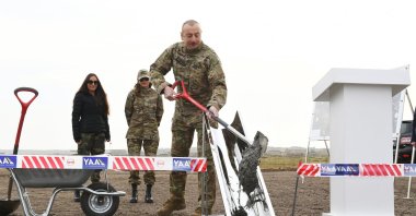 President Ilham Aliyev helps lay the foundation for the Fuzuli airport and Fuzuli-Shusha highway in a recently liberated area of Fuzuli district, Azerbaijan, Jan. 14, 2021. (AA Photo)