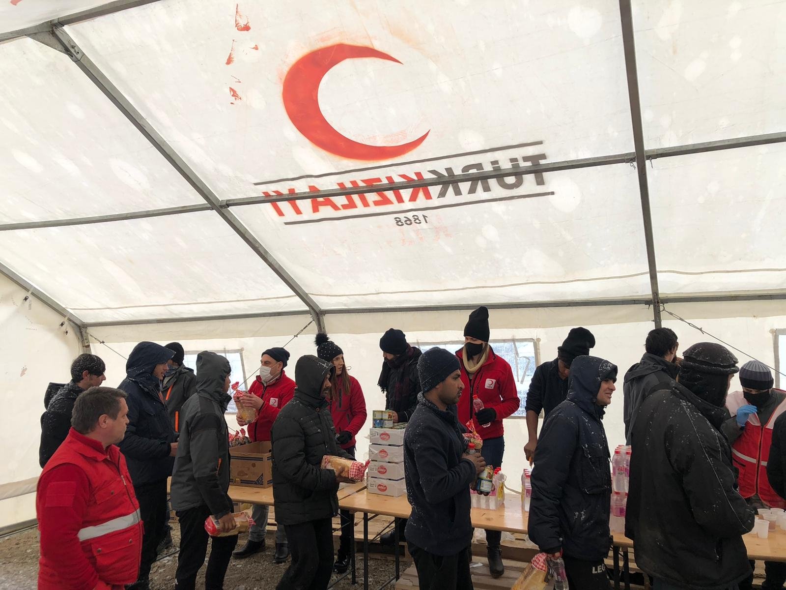 Turkish Red Crescent staff deliver food aid sent by the Turkish diaspora in Europe to migrants in Bihac, Bosnia-Herzegovina, Jan. 15, 2021. (AA PHOTO)