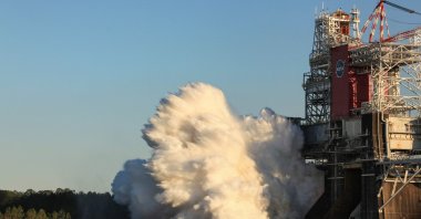 This handout photo released courtesy of NASA shows the core stage for the first flight of NASA's Space Launch System rocket in the B-2 Test Stand during a scheduled eight minute duration hot fire test, January 16, 2021, at NASA’s Stennis Space Center near Bay St. Louis, Mississippi. (AFP Photo/NASA/Robert Markowitz)