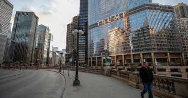 A man walks by Trump International Hotel and Tower in Chicago, Illinois, U.S., March 21, 2020. (AFP Photo)