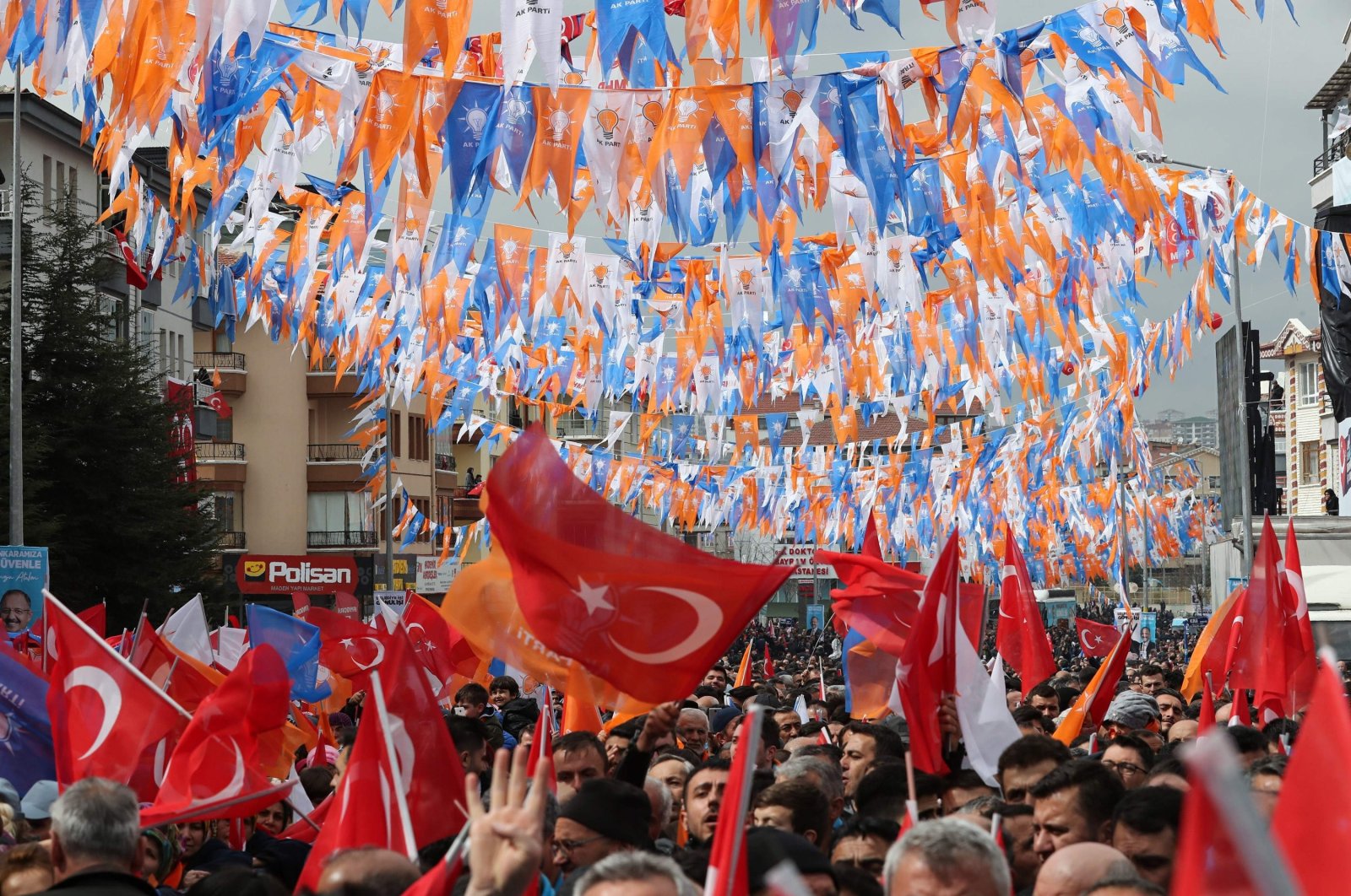 People wave flags as they gather to listen to President Recep Tayyip Erdoğan, the ruling Justice and Development Party's (AK Party) leader, during a party campaign rally in Ankara, Turkey, March 13, 2019. (AFP Photo)