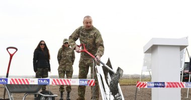 Azerbaijani President Ilham Aliyev pours concrete to inaugurate the construction of a new airport in Fuzuli, Azerbaijan, Jan. 15, 2021. (AA Photo)