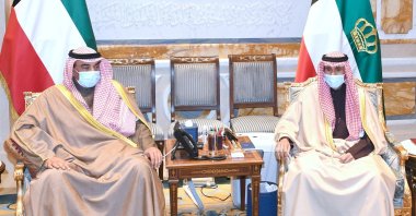 Kuwait's Prime Minister Sabah Al Khalid Al Sabah meets with Emir Sheikh Nawaf Al Ahmed Al Sabah to present the resignation of his Cabinet, in Kuwait City, Kuwait Jan. 13, 2021. (Kuwait News Agency/Al-Diwan Al-Amiri/Handout via Reuters)
