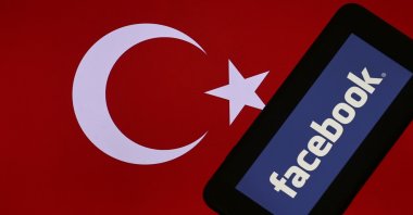 The Facebook logo is seen on a mobile phone screen with the Turkish flag in the background in this illustration photo, in the capital Ankara, Turkey, Jan. 18, 2021. (AA Photo)